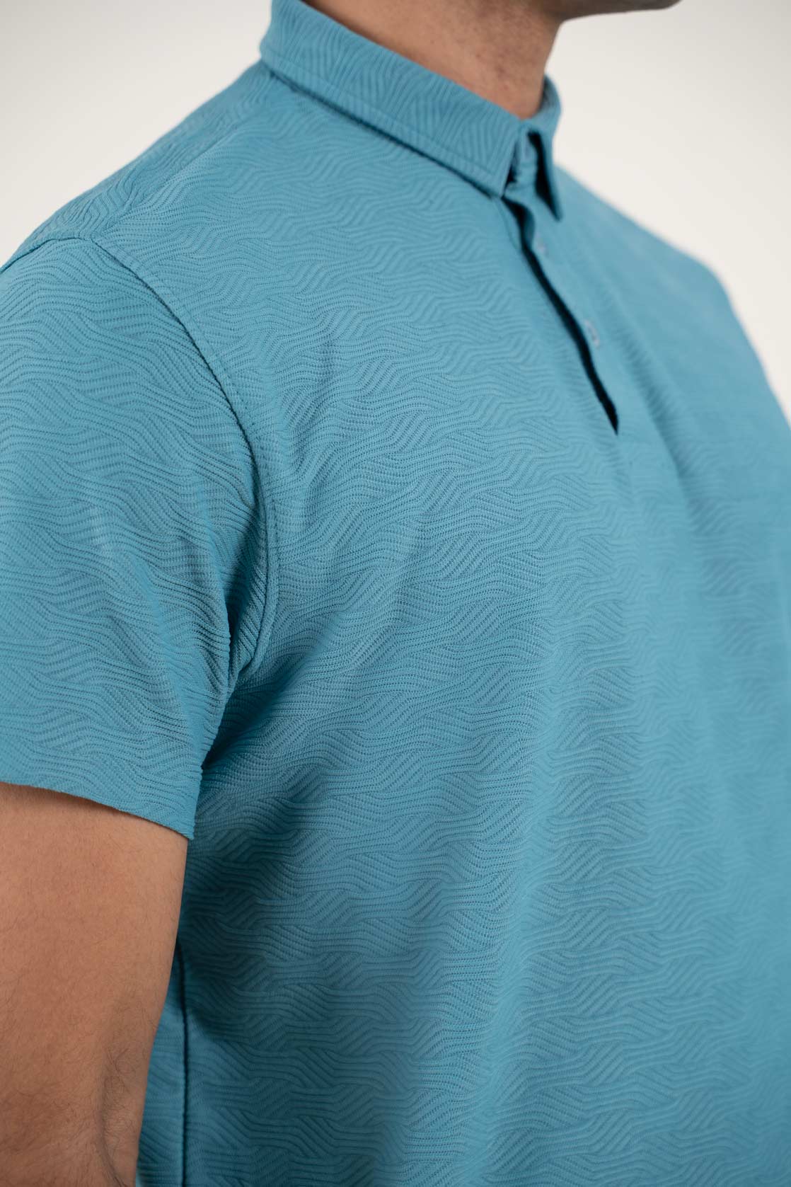 man wearing blue tshirt chest closeup View