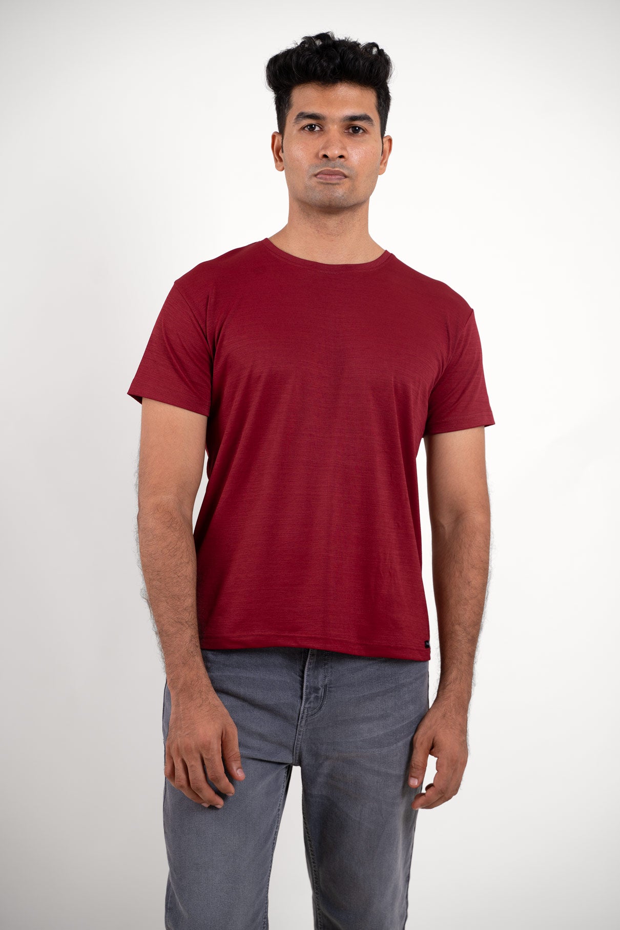 Front view of a vibrant red round neck t-shirt, featuring a classic and timeless design