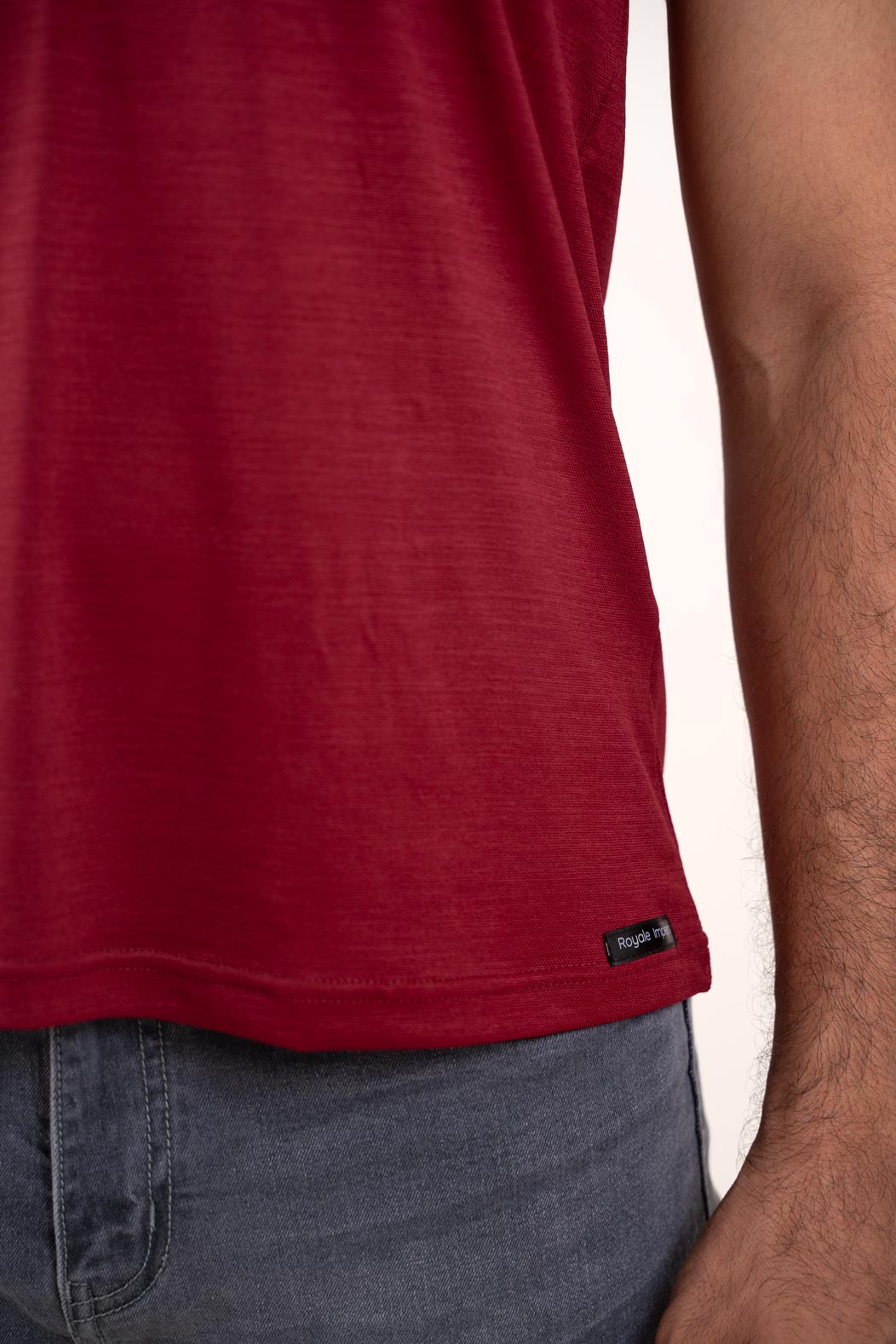 Closeup image of the red round neck t-shirt, allowing viewers to appreciate its comfortable and flattering fit