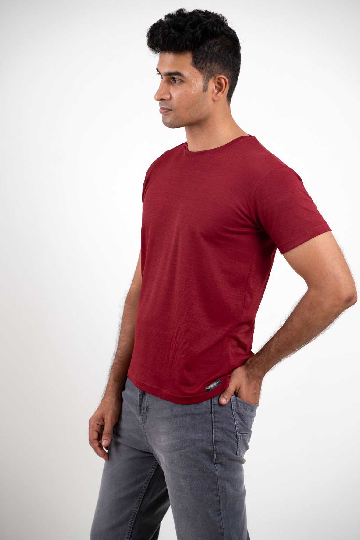 Side angle of the red solid t-shirt, displaying its versatility and suitability for various occasions