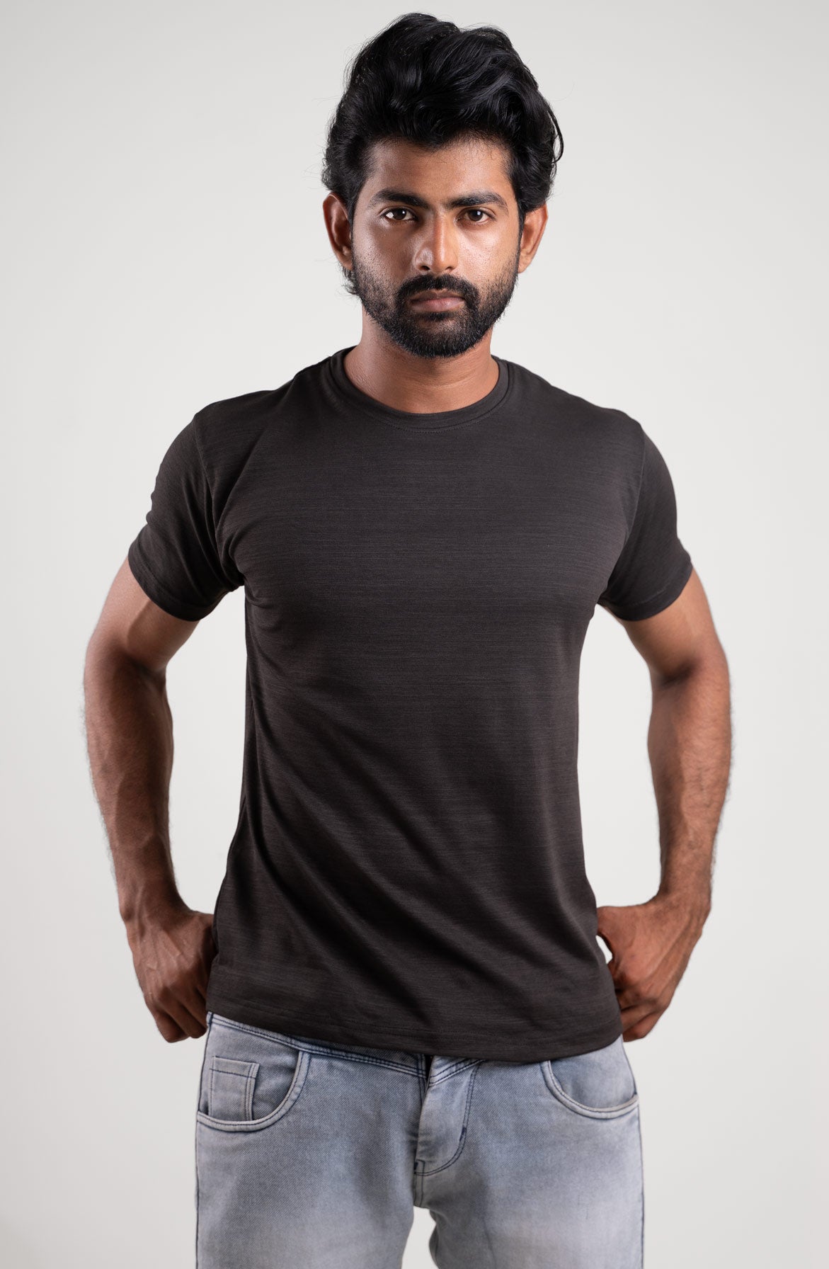 Front view of a classic black crew neck t-shirt, an essential piece for any wardrobe