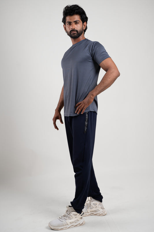 Side angle of the active dark grey crew neck t-shirt, displaying its ergonomic fit and activewear appeal