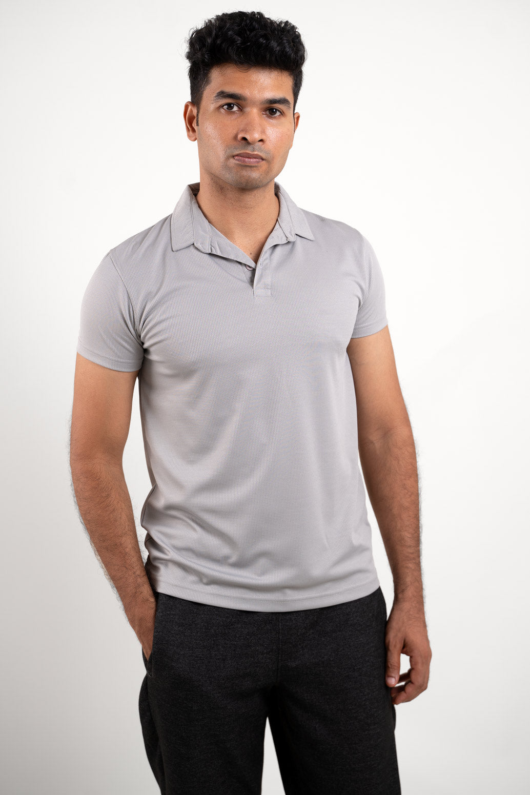 Front view of an active light grey solid polo t-shirt, featuring a sleek and sporty design