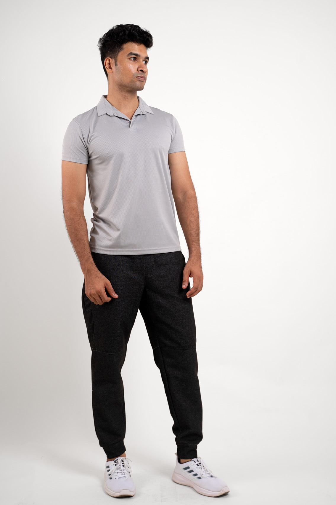 Complete view of the light grey solid polo t-shirt, capturing its athletic style and versatile appeal