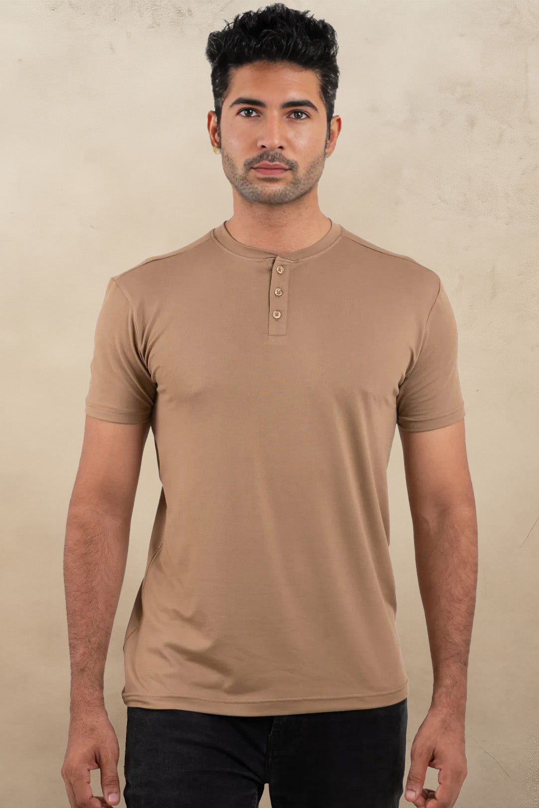 Front view of a beige Henley solid t-shirt, featuring a classic buttoned neckline