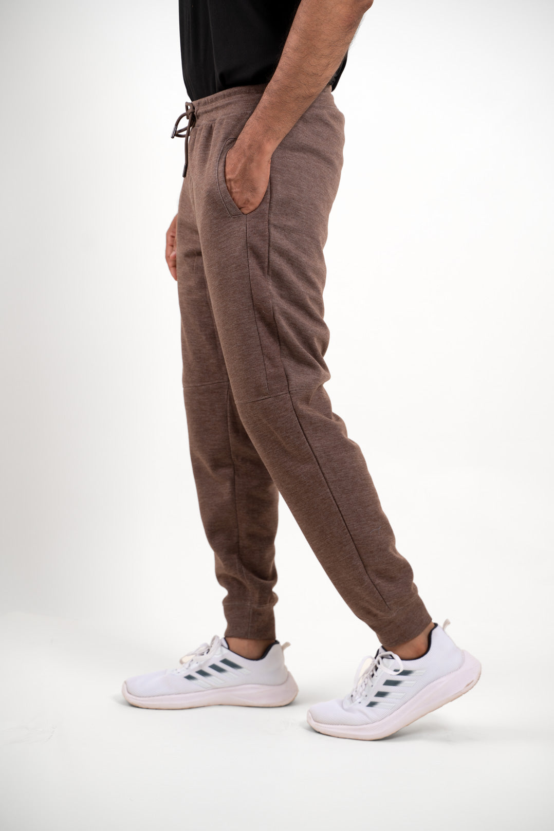 Full-size image of the brown jogger pants, providing a clear view of their overall appearance