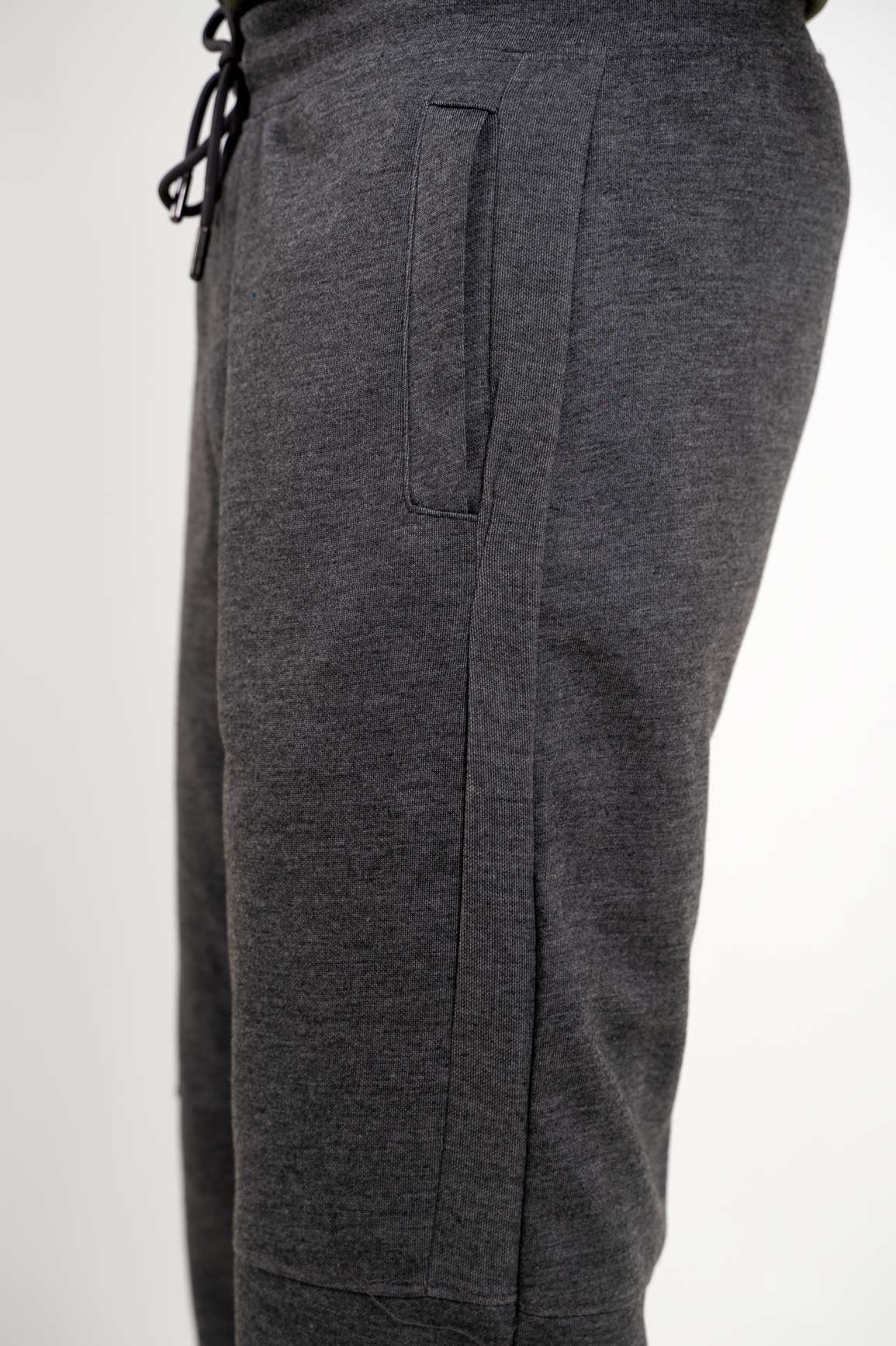 Side angle of the grey joggers, displaying their athletic cut and comfortable wear