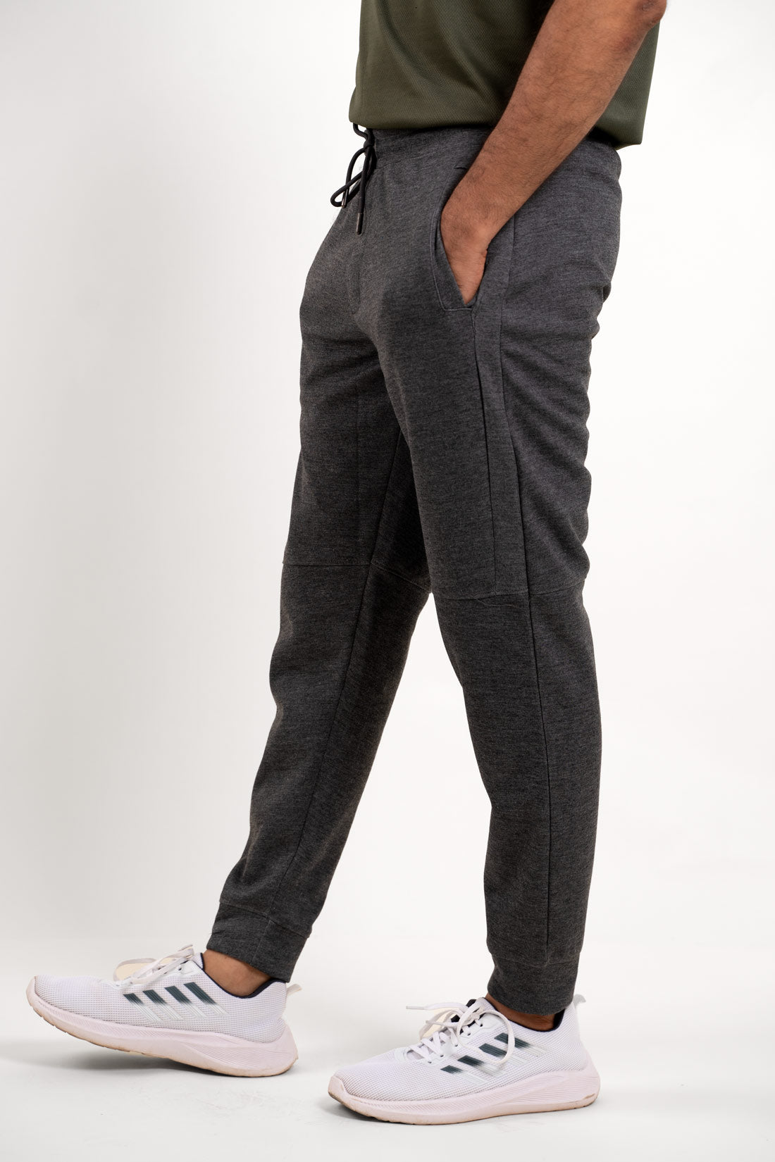 Side angle of the grey joggers, displaying their athletic cut and comfortable wear