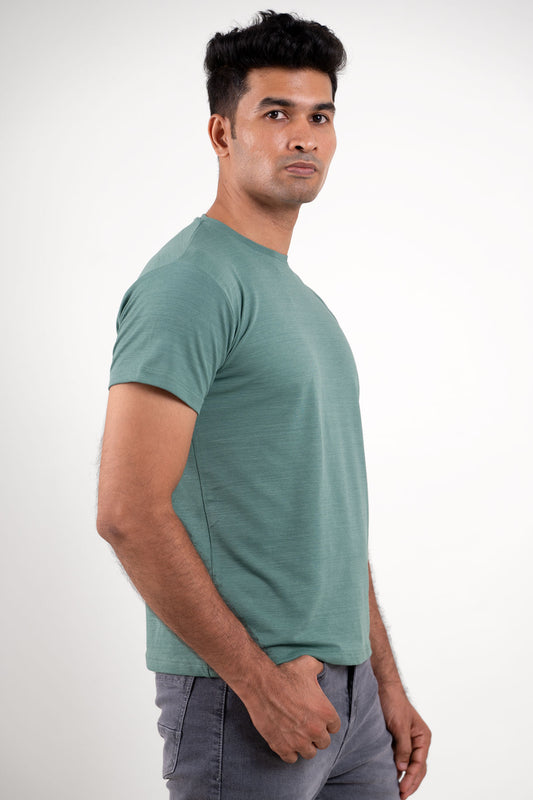 Side angle of the olive green crewneck t-shirt, displaying its tailored silhouette and casual charm