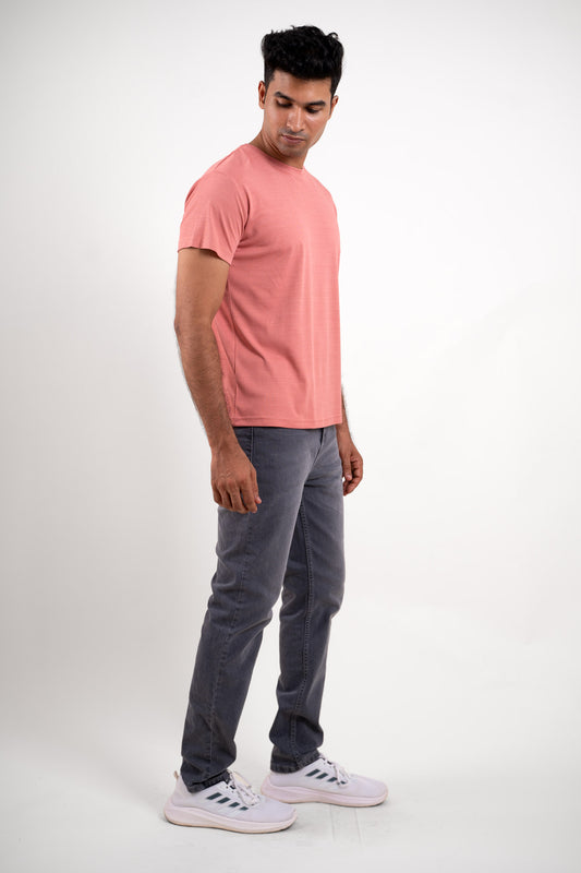 Full-length image of the pink crew neck t-shirt, providing a comprehensive look at its overall fit and style