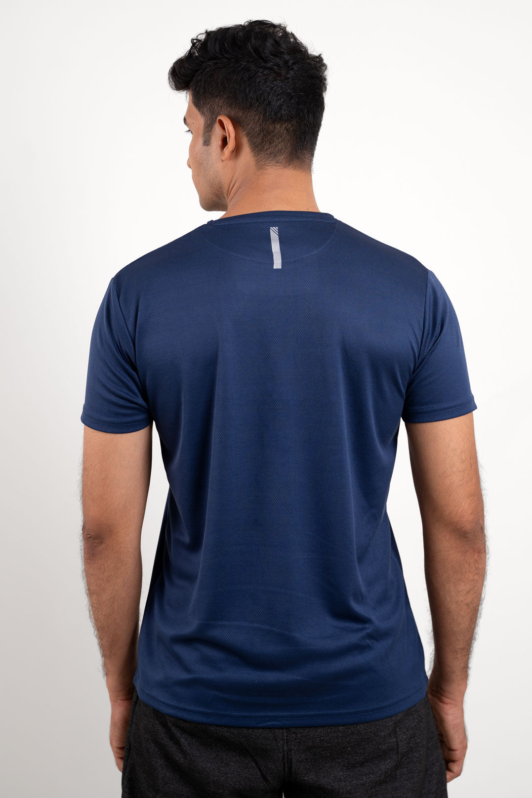 Rear view of the navy blue crew neck t-shirt, illustrating its streamlined design and comfortable fit