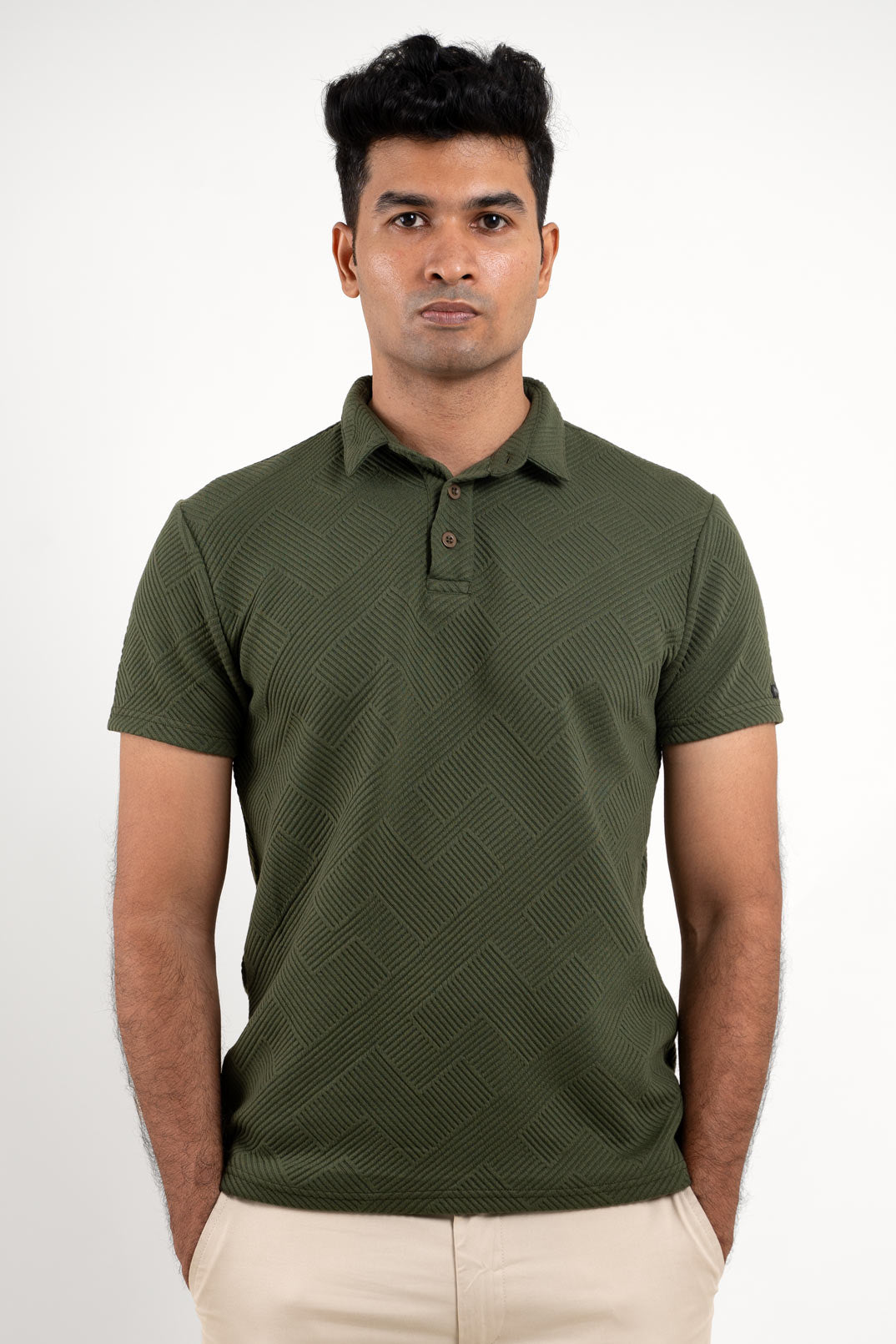 Man's textured green polo t-shirt, front view showing classic fit