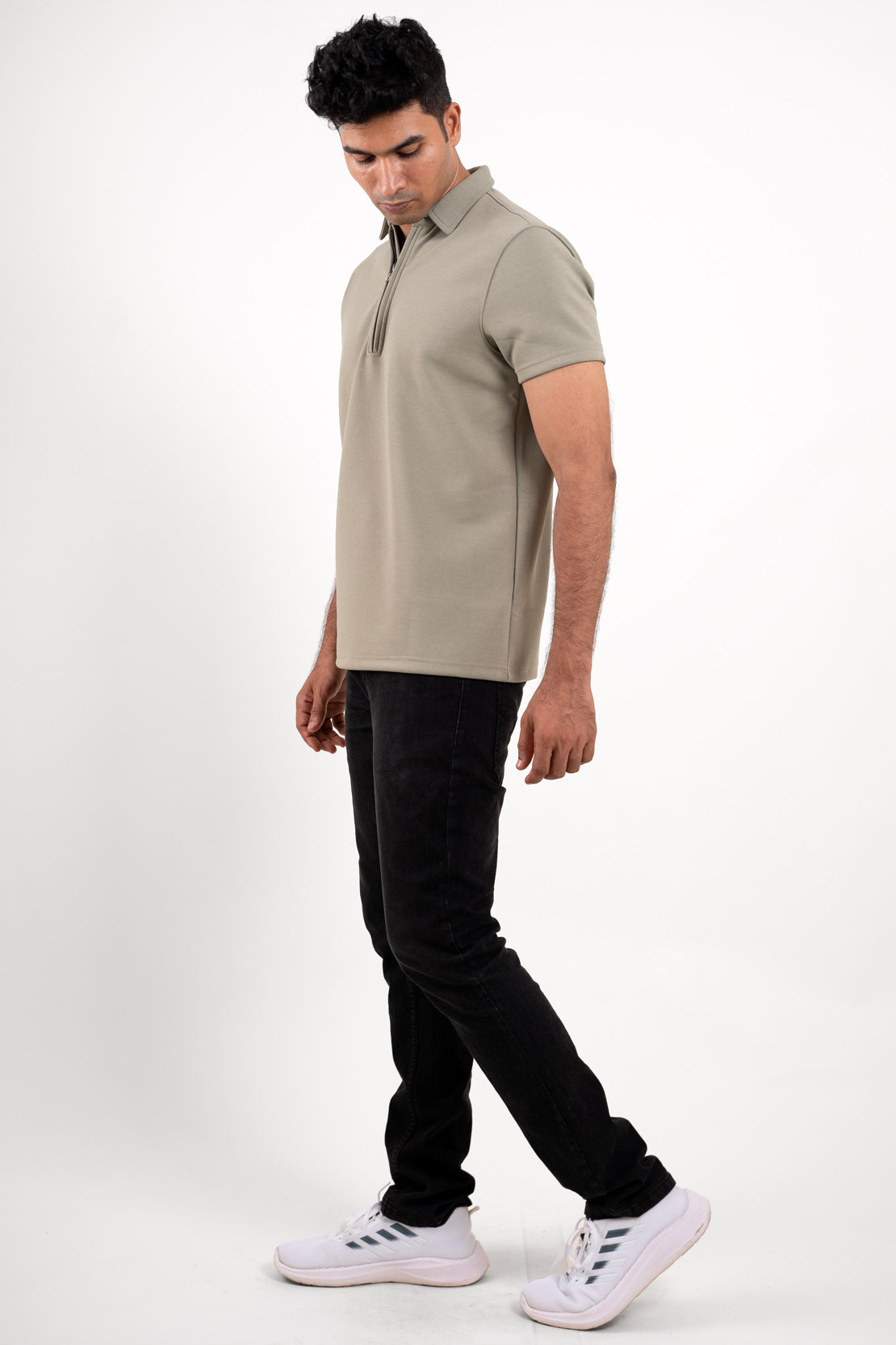 Full-length image of the light green zipper collar polo shirt, providing a comprehensive look at its overall fit and style