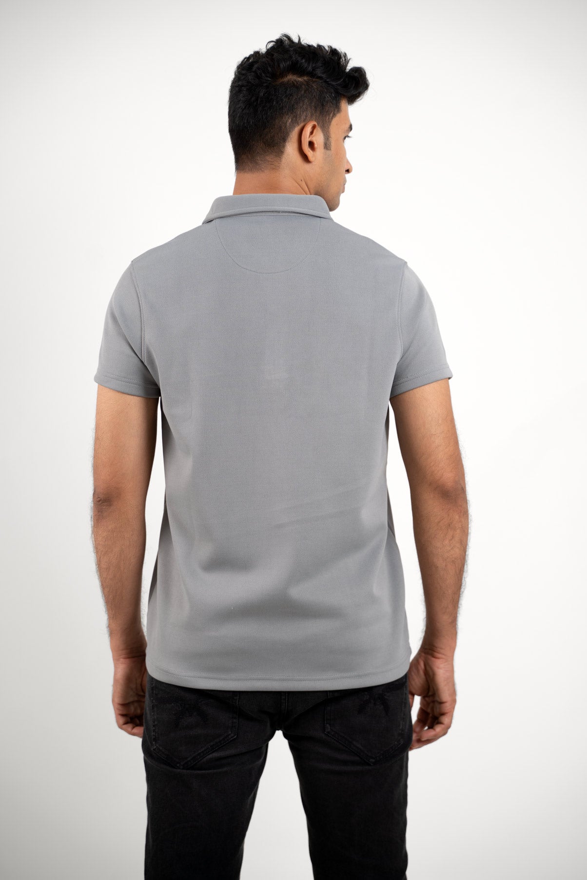 Back view of the solid grey zipper polo shirt, highlighting its clean lines and smooth finish