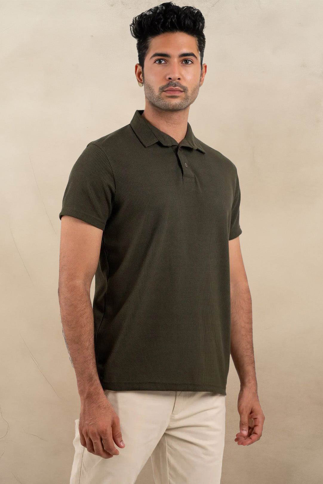 Front view of an olive polo shirt with a wavy texture, showcasing its unique and stylish design