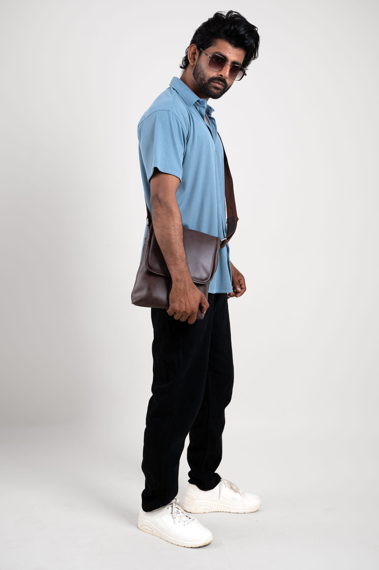 Side view of man wearing blue shirt