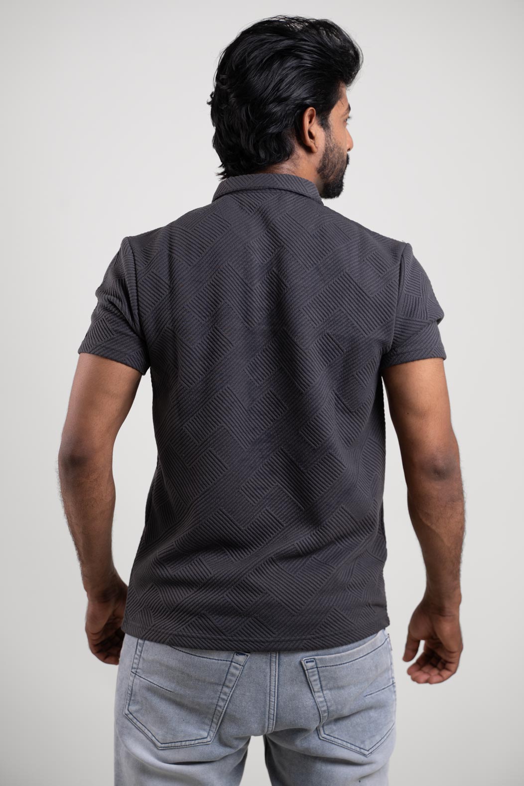 Back view of the grey solid t-shirt, displaying its simple yet stylish design