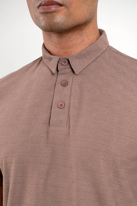 man wearing light brown tshirt detailed view