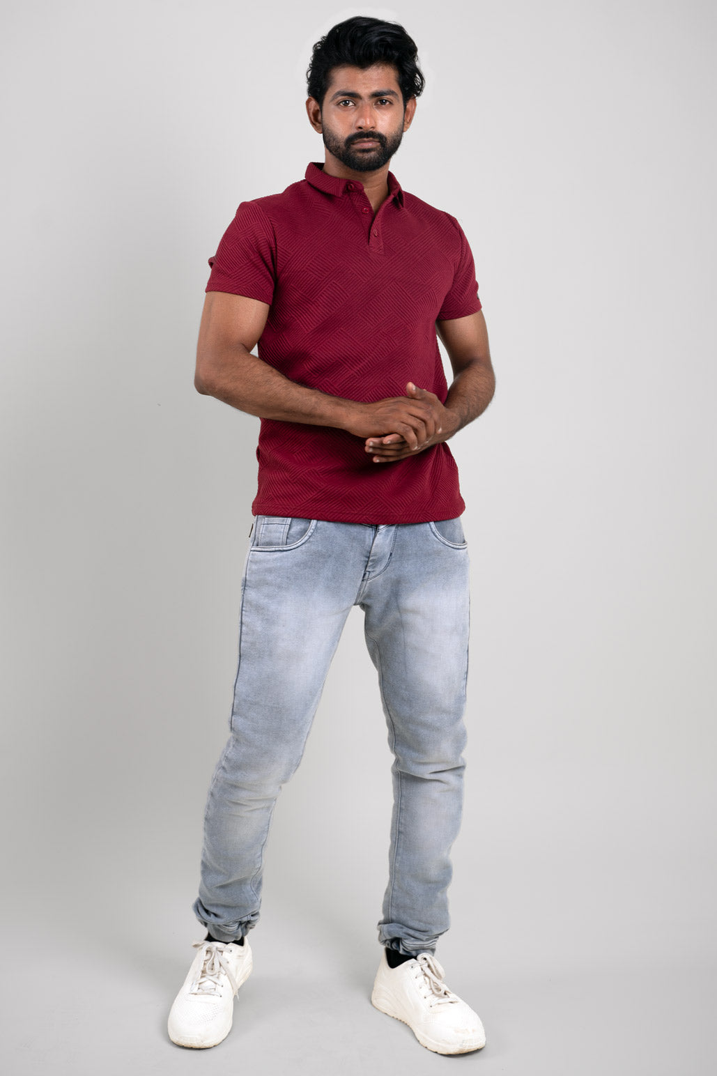 Full-length image of the red solid polo, allowing viewers to appreciate its vibrant color and stylish appearance