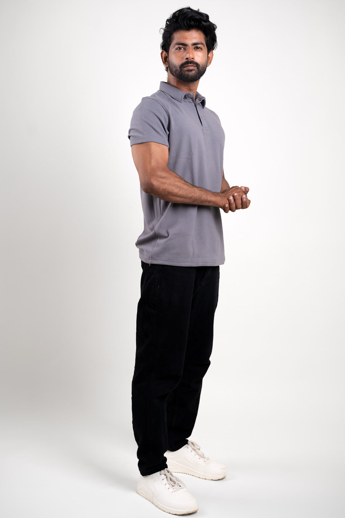 Man in grey polo t-shirt with short sleeves, front view