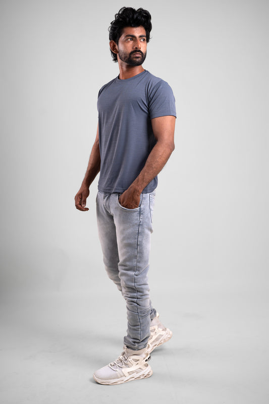 Side angle of the grey crewneck t-shirt, displaying its relaxed fit and effortless style