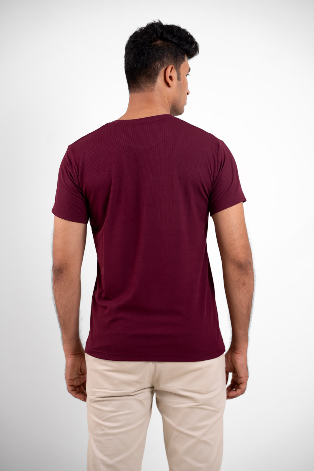 Back view of the essential red crewneck t-shirt, emphasizing its clean lines and timeless design