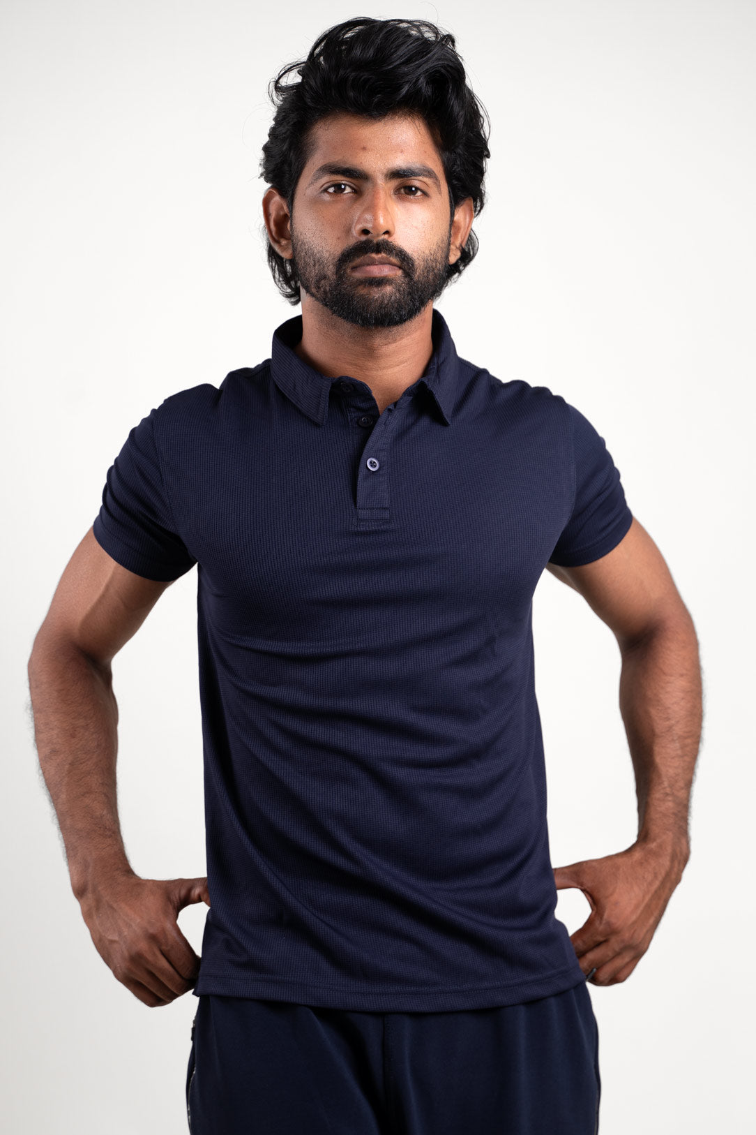 Front view of an active navy blue polo t-shirt, featuring a sleek and sporty design