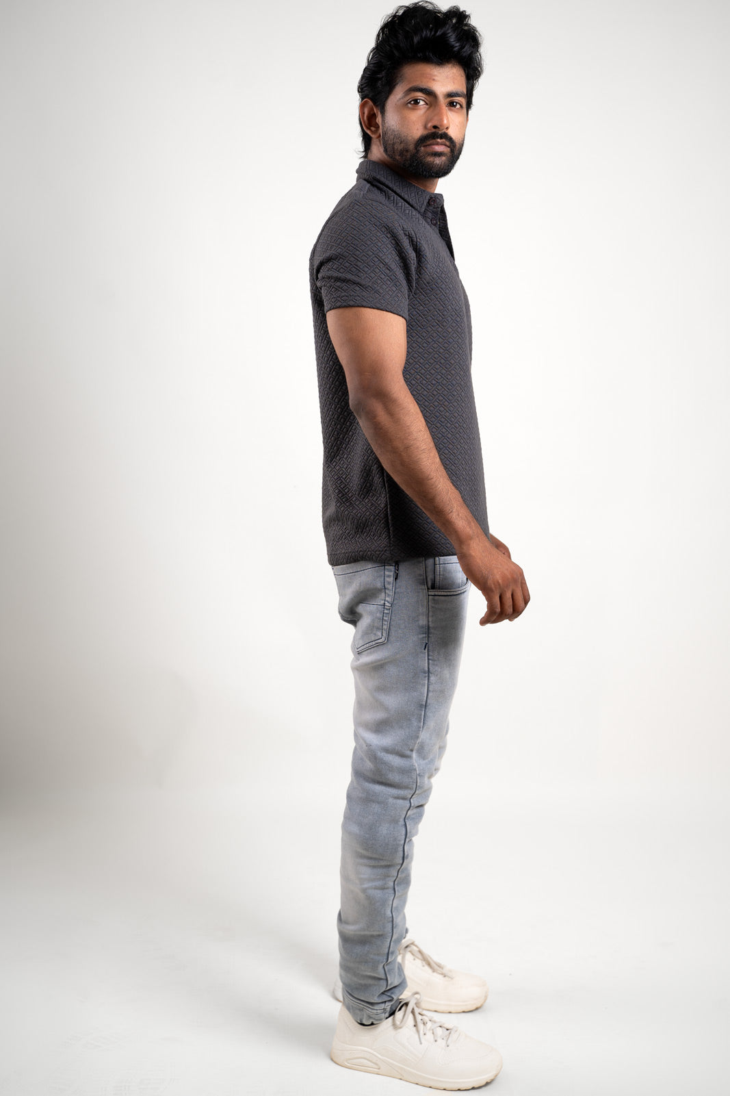 Overall view of the solid grey polo t-shirt, capturing its textured sophistication and versatile appeal